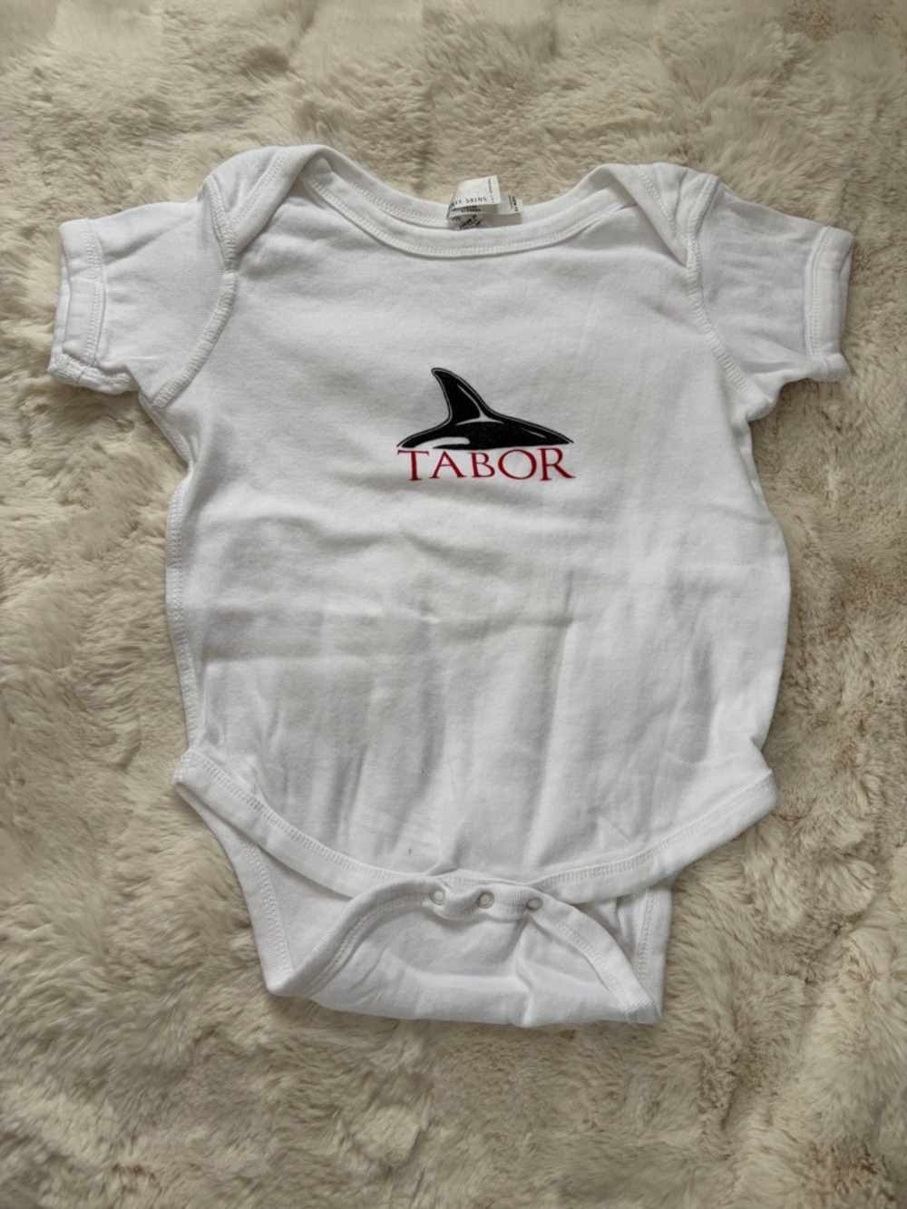 Rabbit Skins White Baby Onesie with Tabor Logo